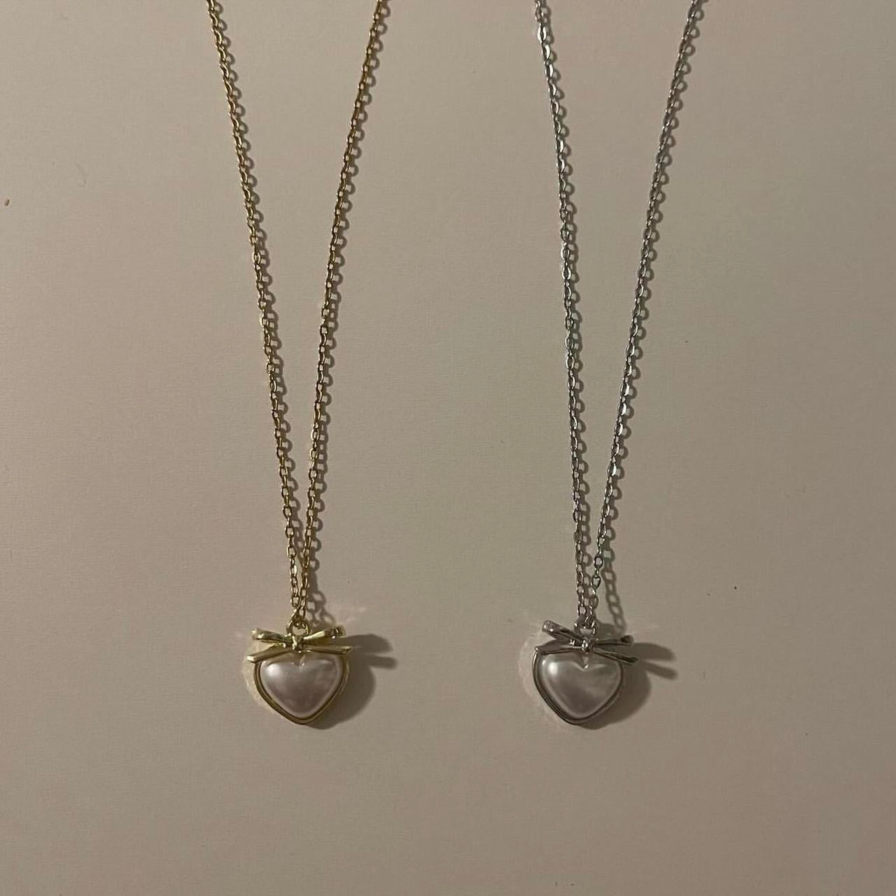 ‘heart and bow’ matching necklaces!