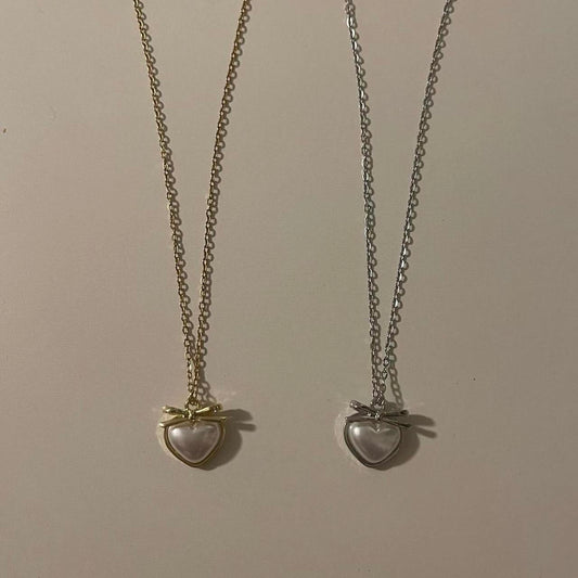 ‘heart and bow’ matching necklaces!