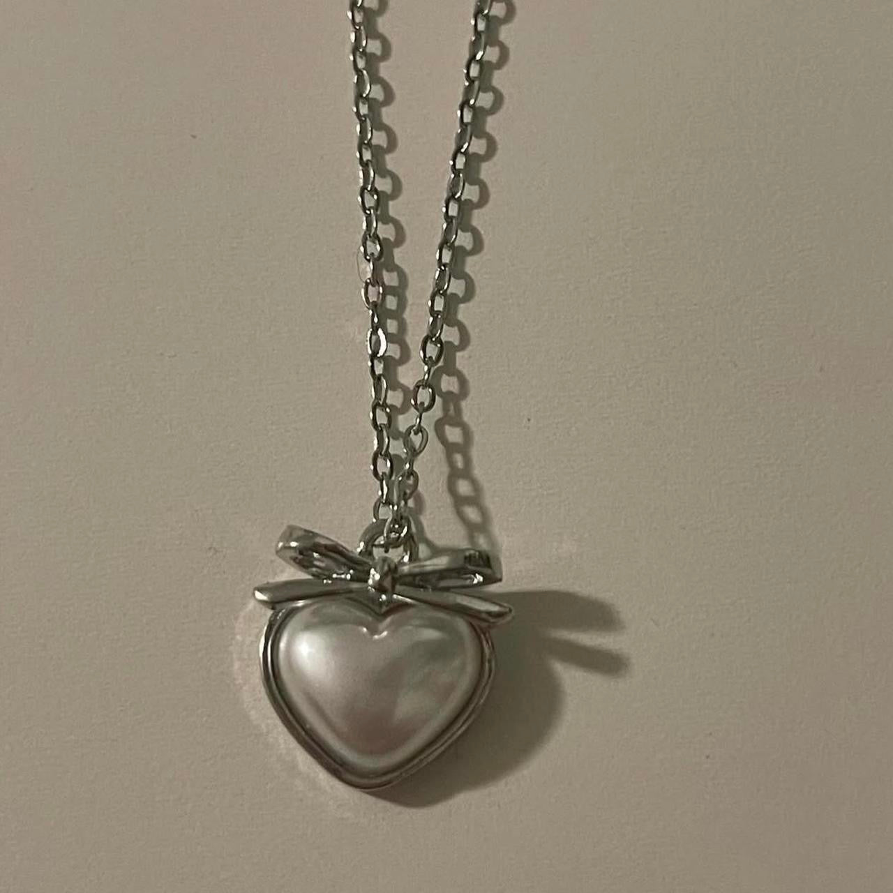 ‘heart and bow’ matching necklaces!