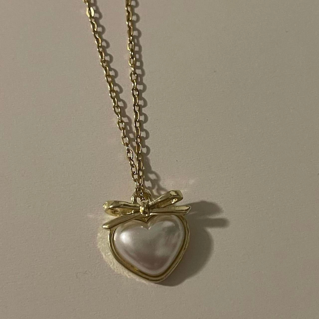 ‘heart and bow’ matching necklaces!